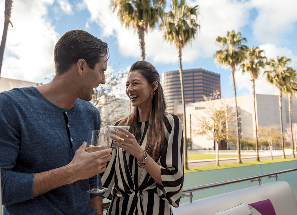 man and woman holding wine glasses