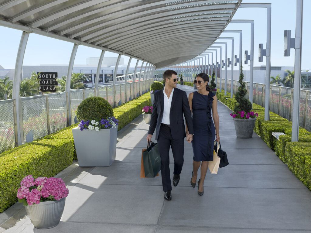 man and woman standing on gray concrete floor during daytime