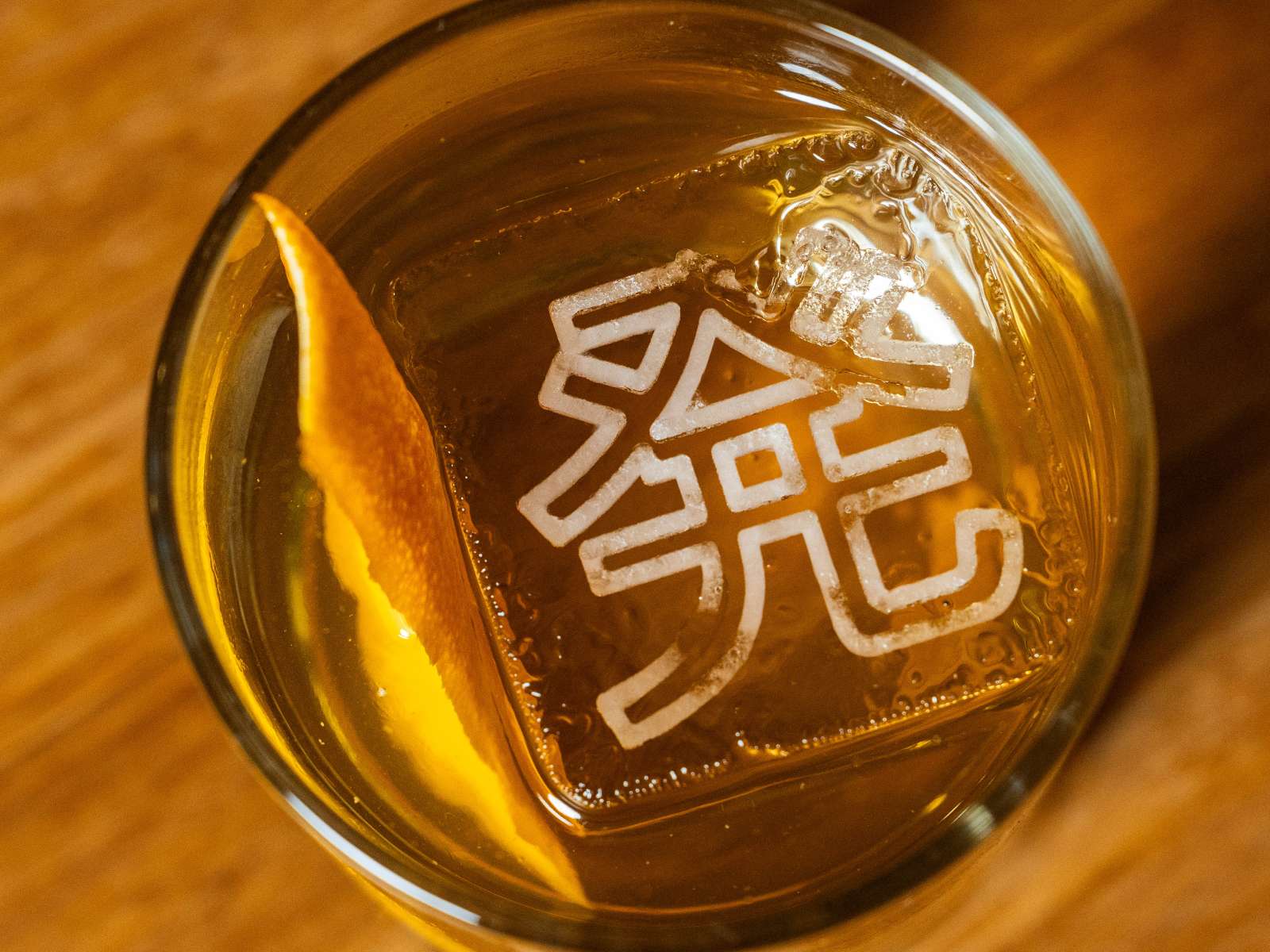 Departure-Cocktail a cocktail with an orange slice garnish