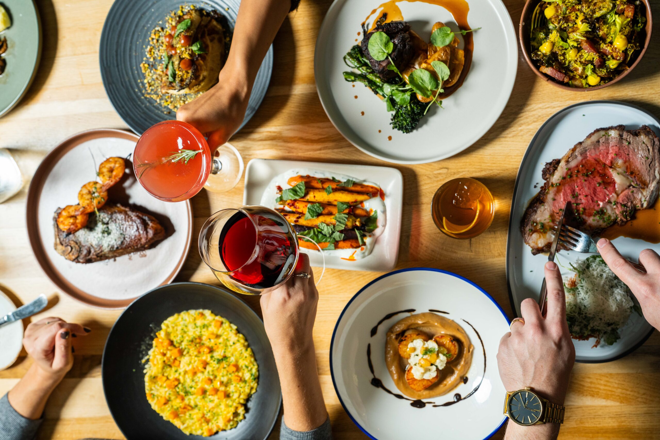 Gather at Urban Farmer a group of people sitting at a table with plates of food