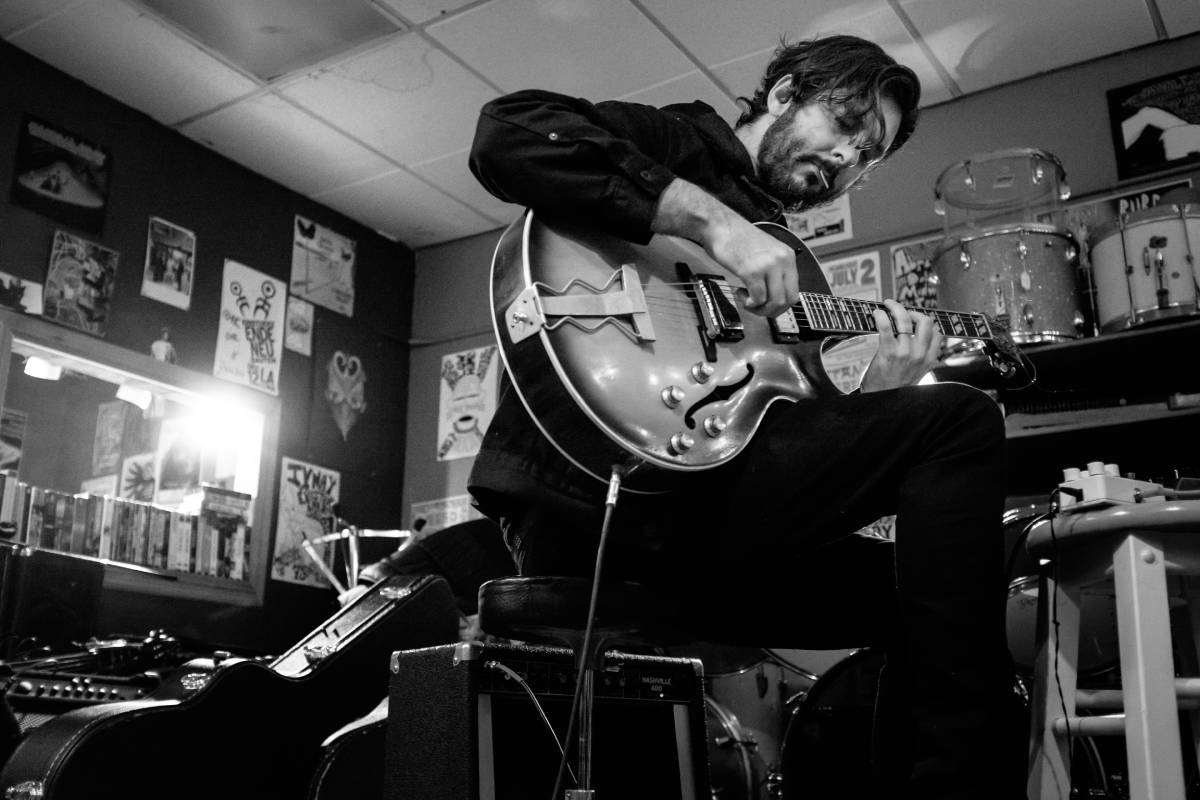 Mike-Gamble a man playing a guitar