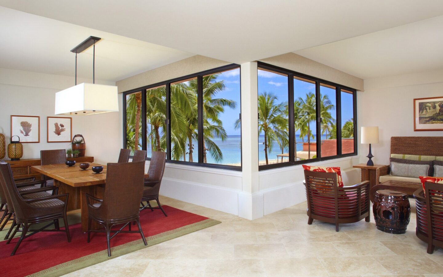 hotel suite dining room with table and chairs, and with ocean view