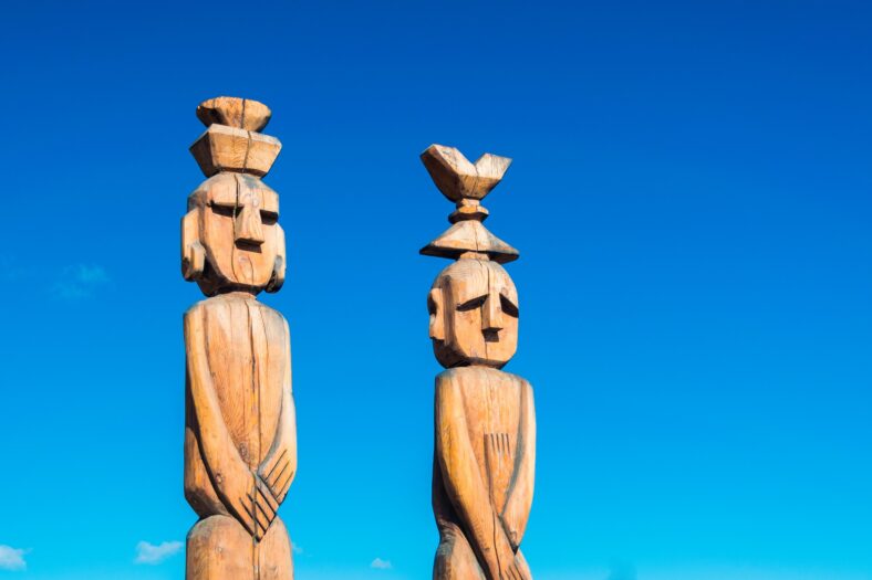 two brown wooden statues