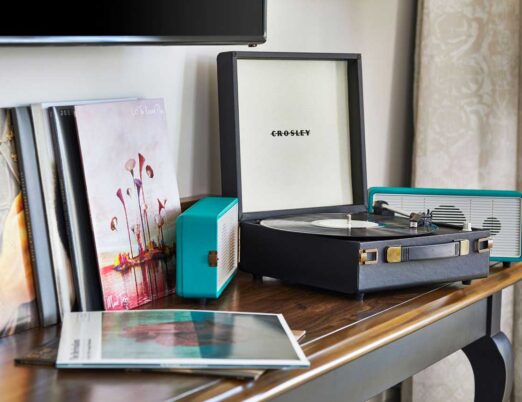 record player and records on a brown table