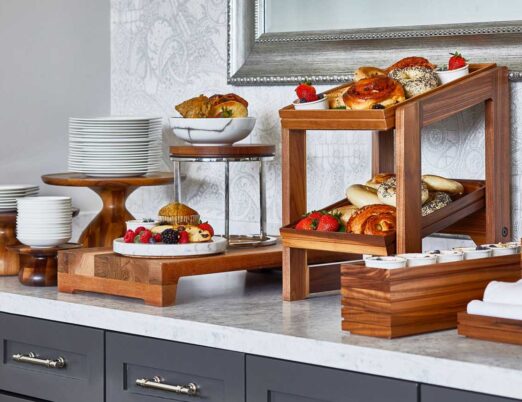 wooden display shelves containing breakfast foods and fruits