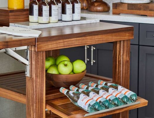 wooden display shelves with fruits, juices, and water bottles