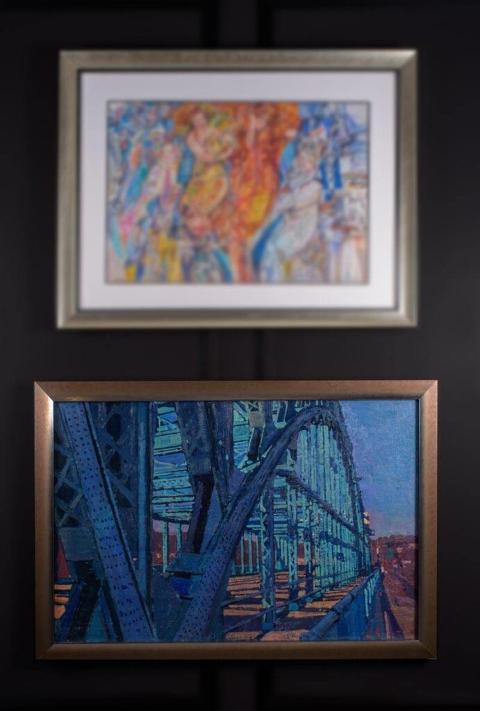 artwork displayed on a black wall