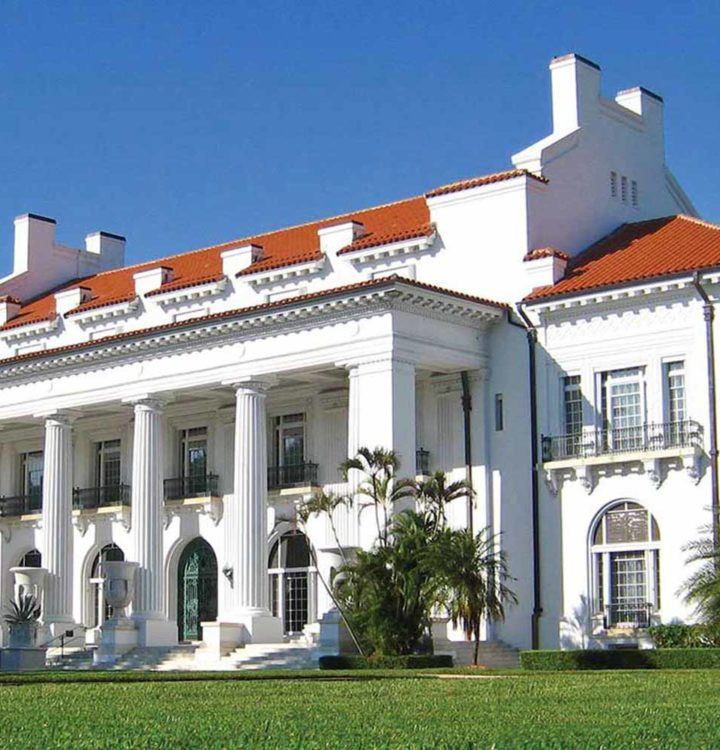 white concrete building surrounded by trees