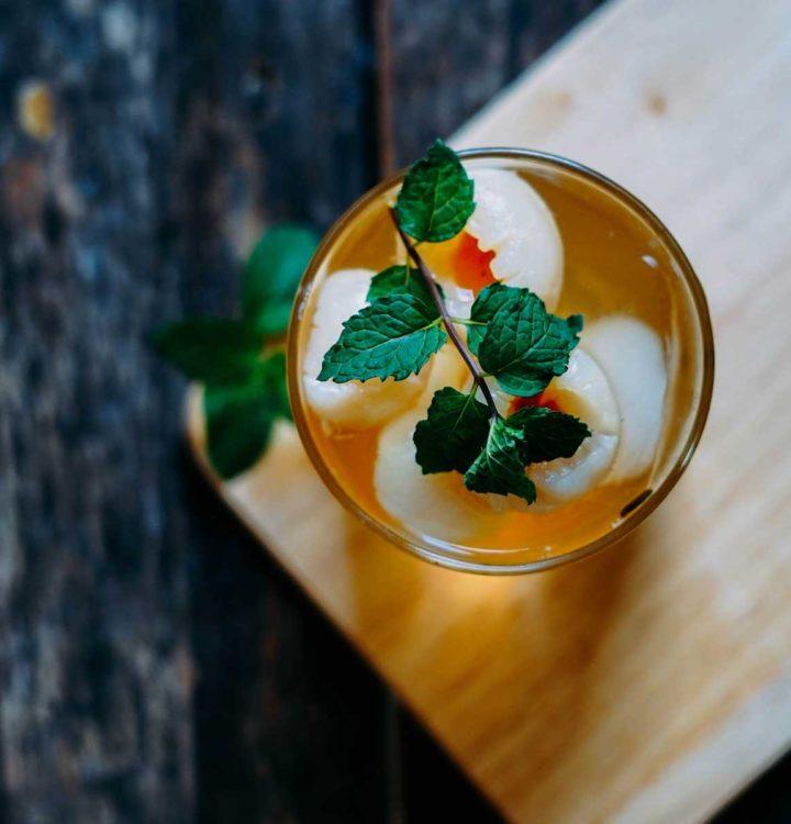 green leaves in beverage filled cup