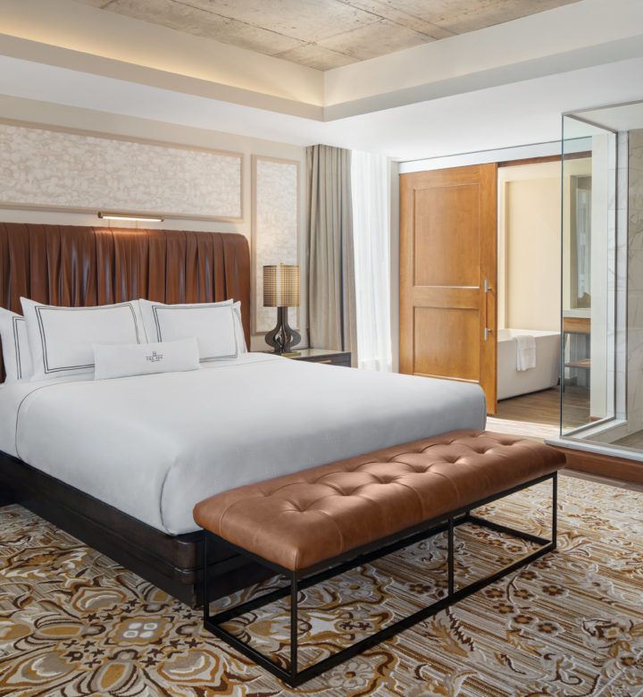 white bed linen on bed