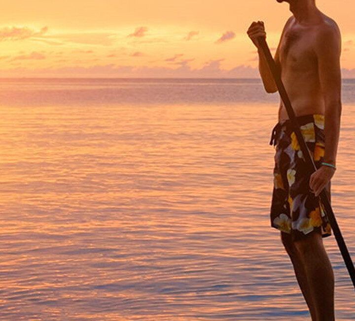 paddle board sunset