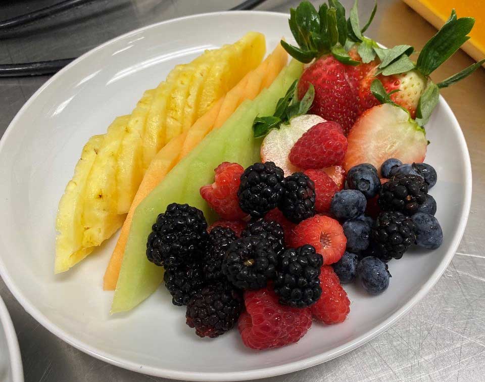 sliced fruits on white ceramic plate