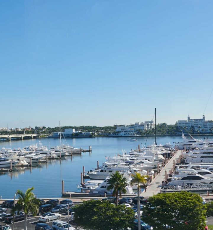jetties stretching into the water with sailboats moored to them