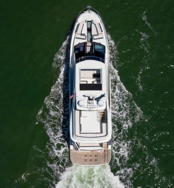 top view of a yacht traveling across a body of water
