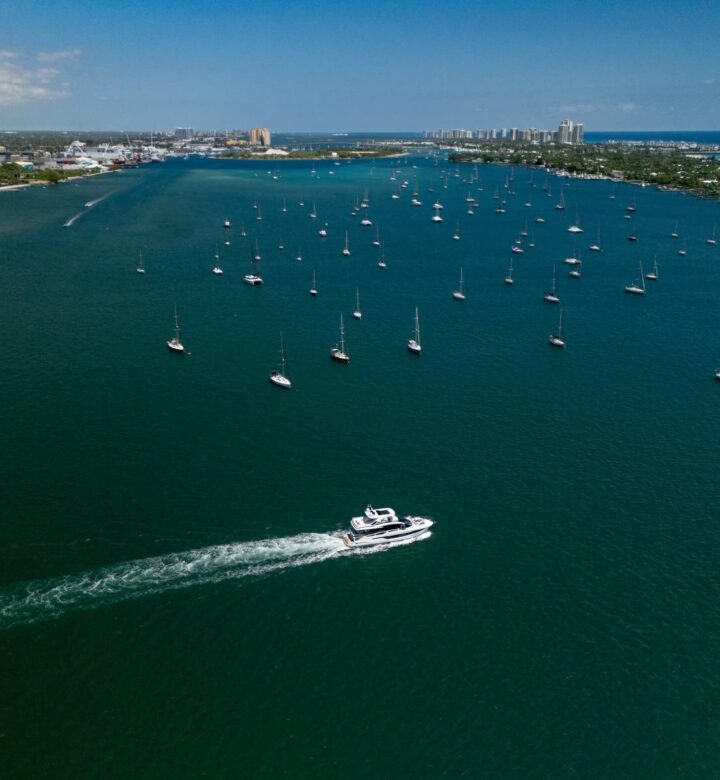 white boat on sea during daytime