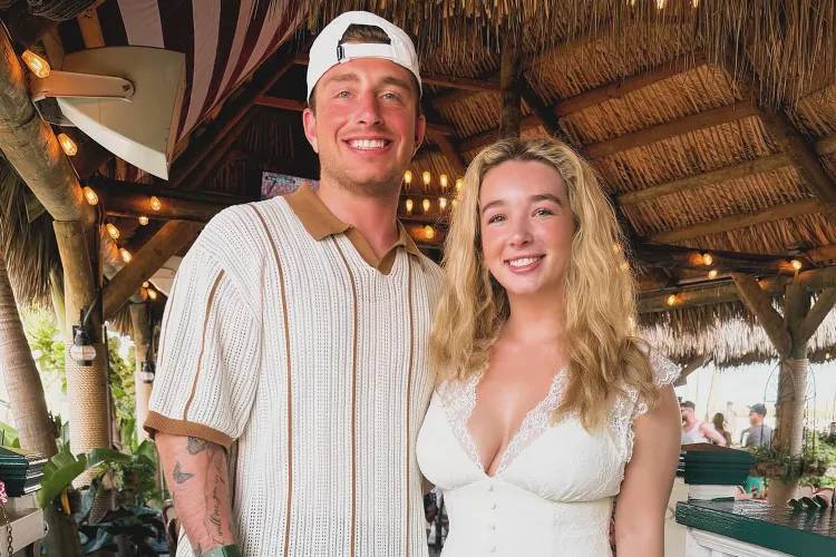 man in white and gray striped polo shirt beside woman in white dress