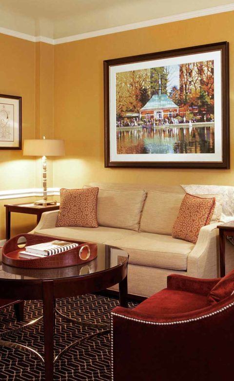 white and red sofa set beside table lamps