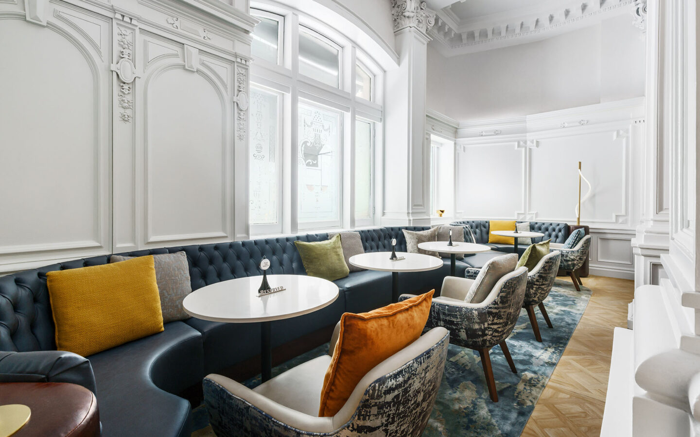 a hotel lobby sitting area beside a large window