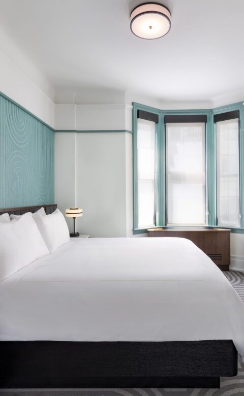 white bed linen on bed