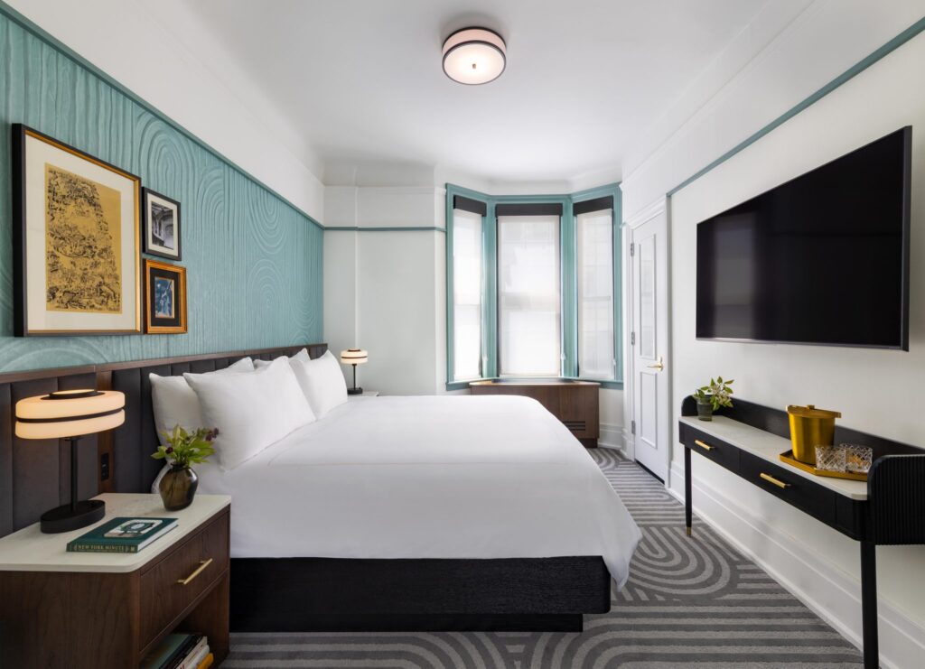 white bed linen on bed