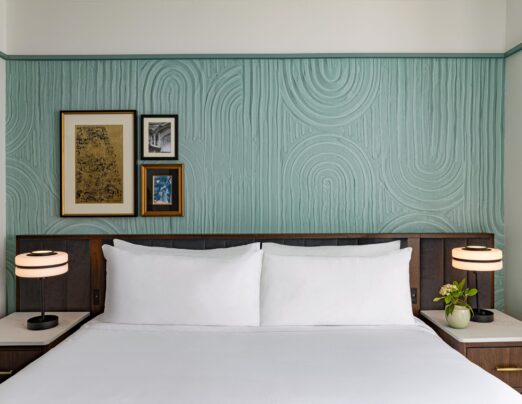 white bed linen with white pillows