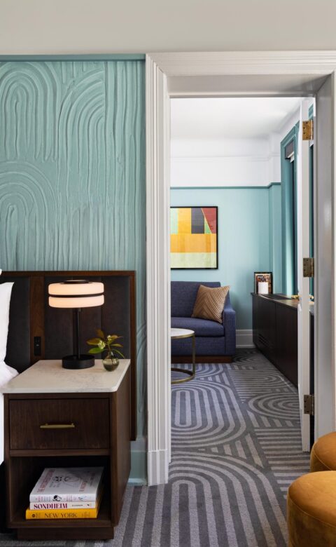 white bed linen near brown wooden nightstand