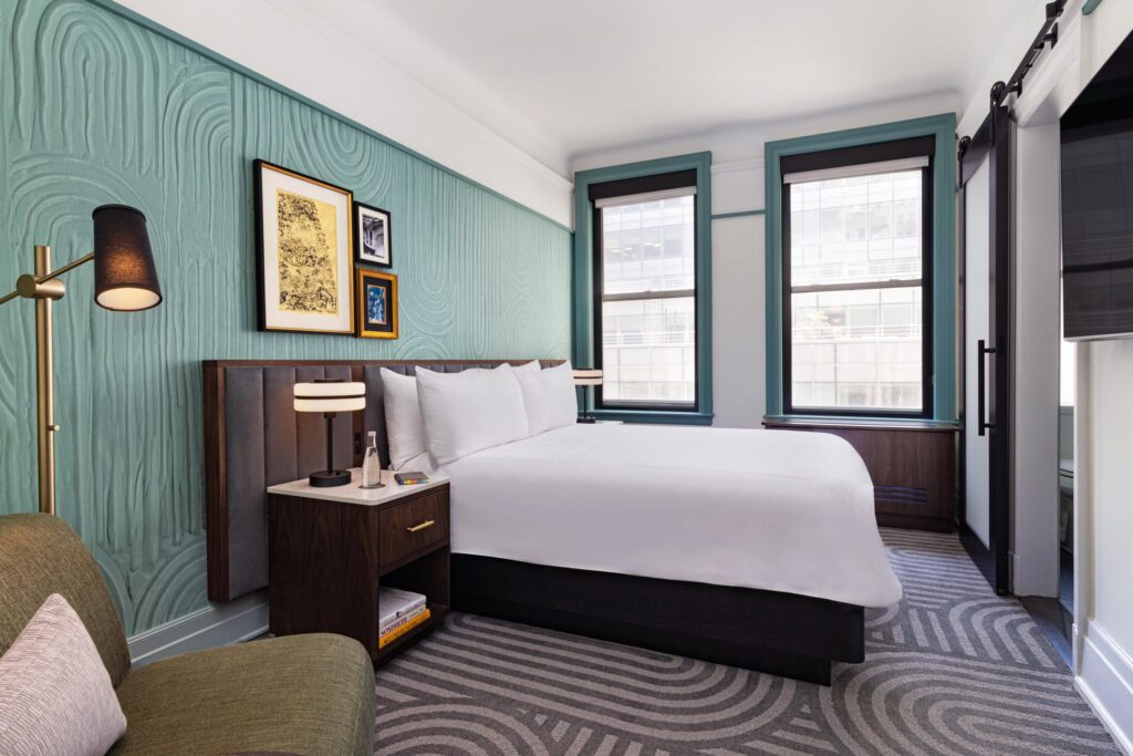 white bed linen on bed