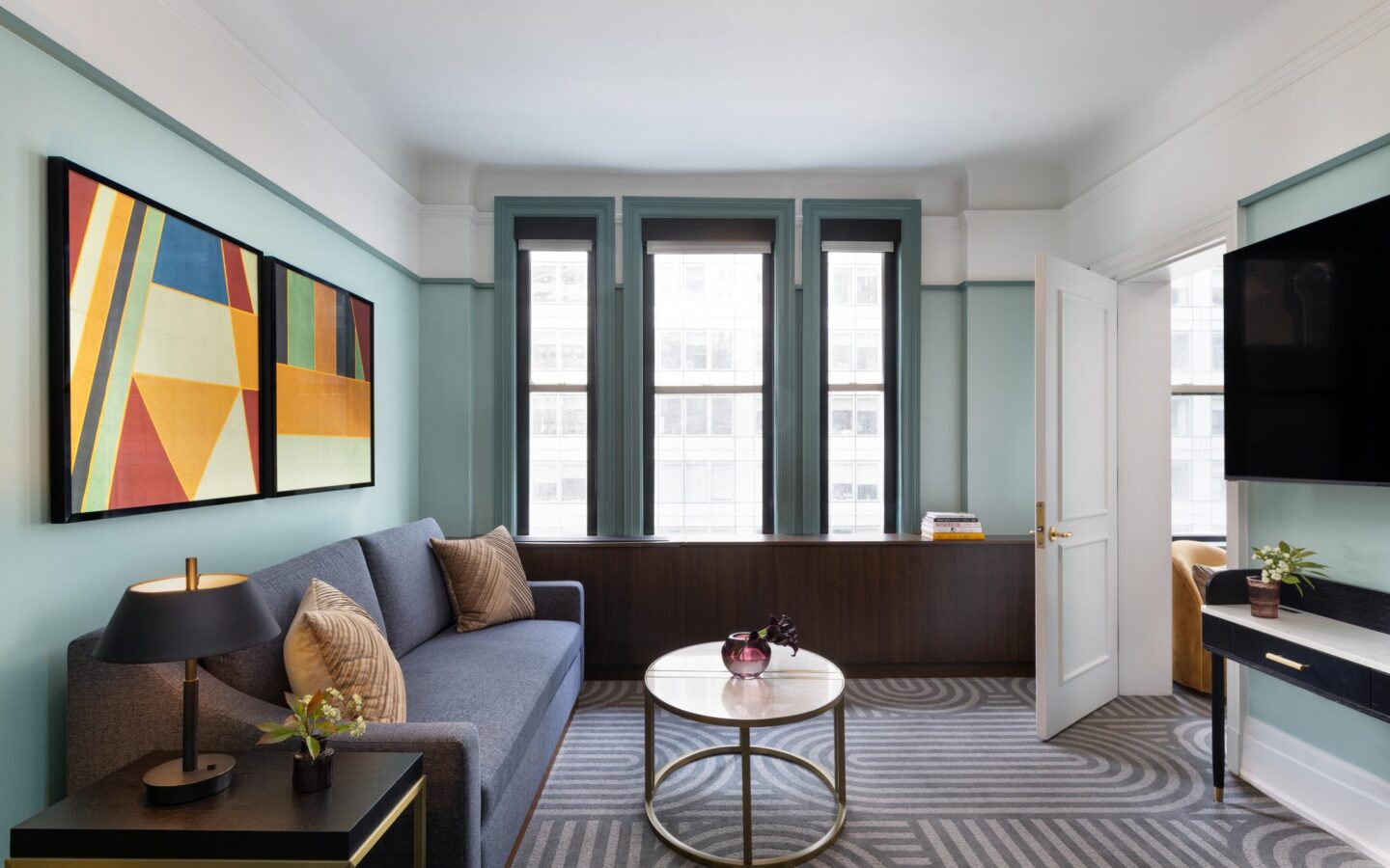 gray sofa near white wall