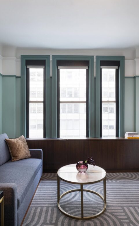 gray sofa near white wall