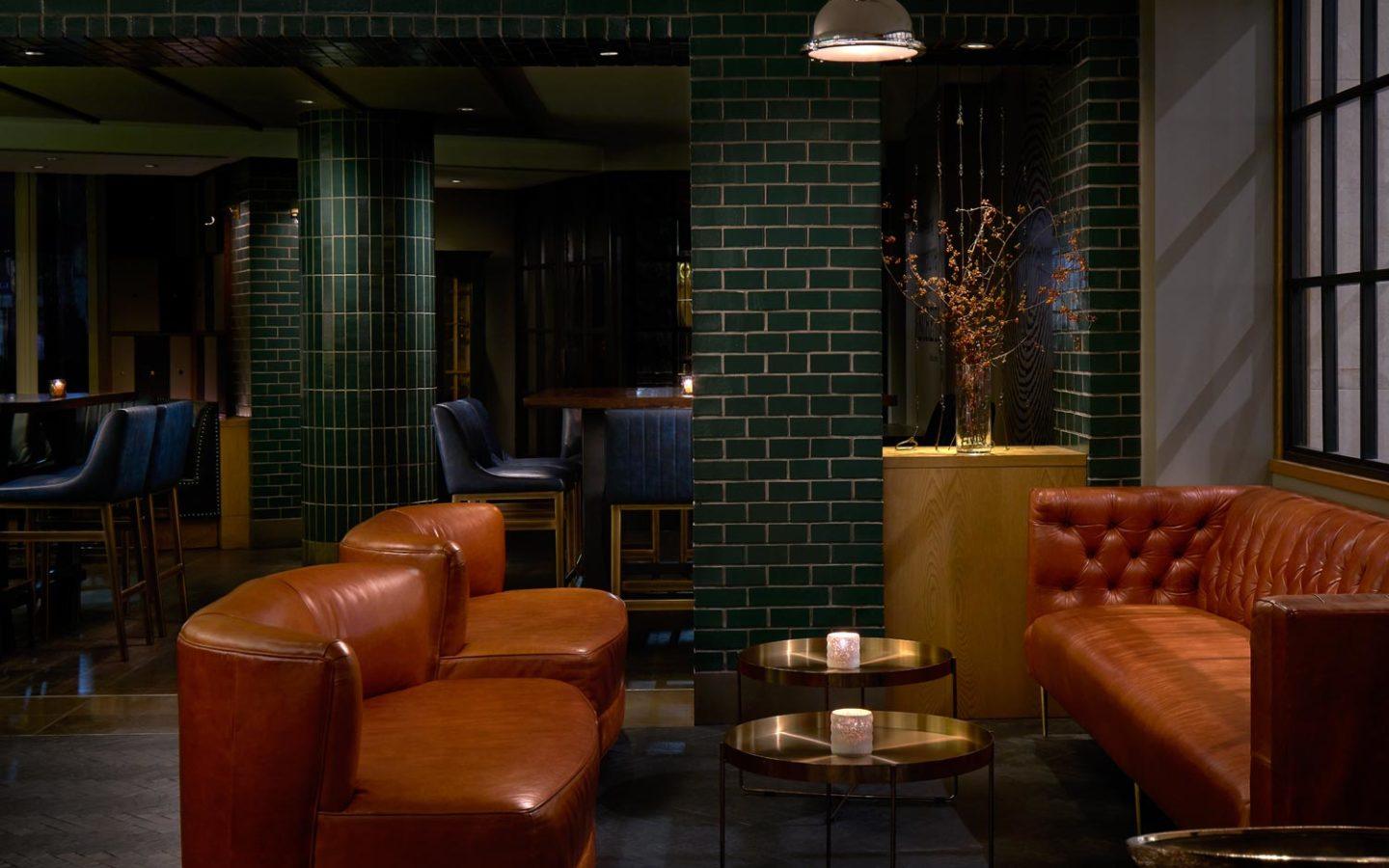 brown wooden dining table set in dimly lit restaurant