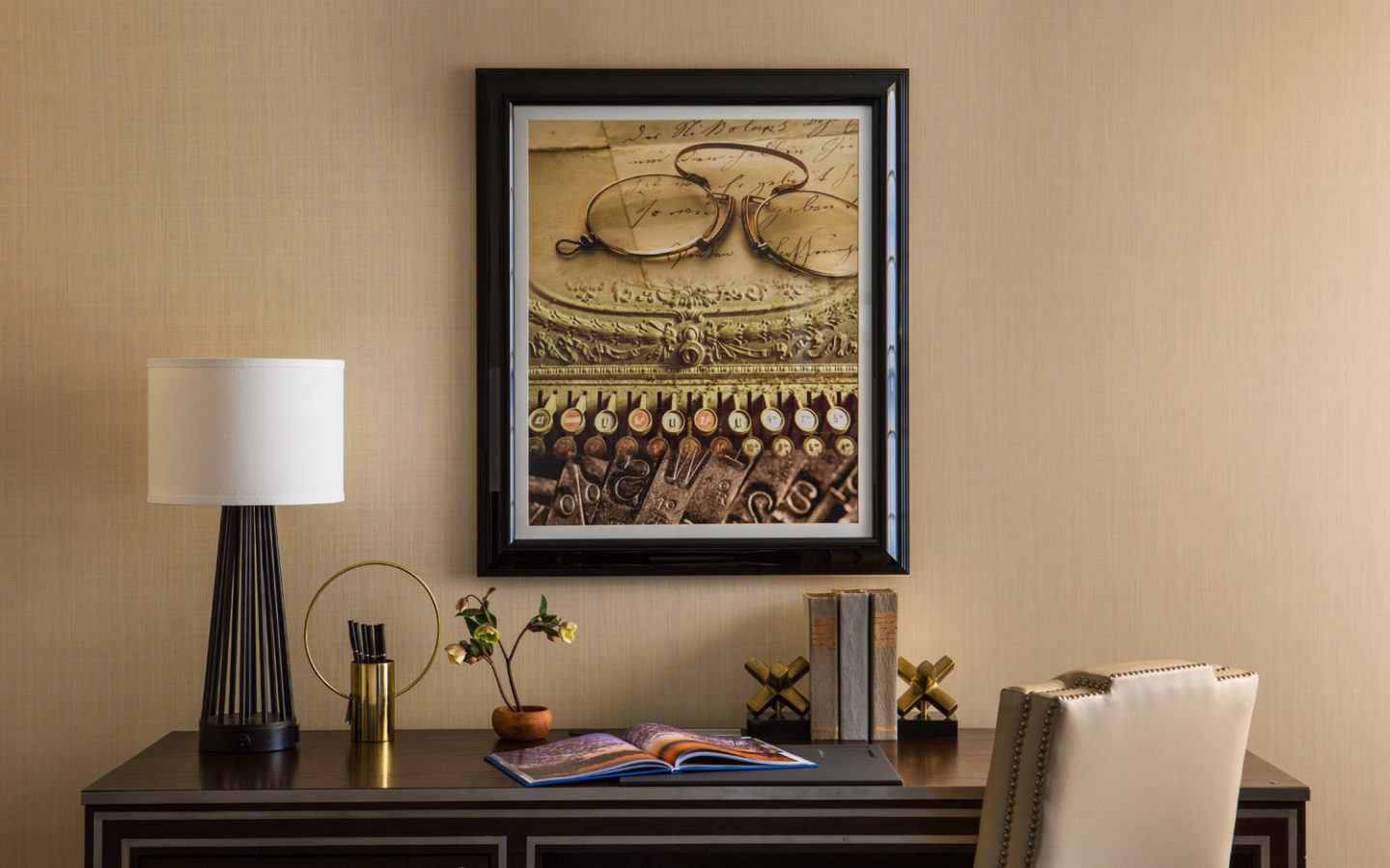 painting above table lamp on brown wooden desk