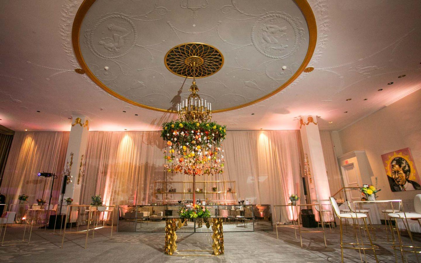 chandelier near white tables