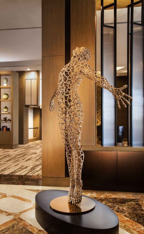 person sculpture at The Phoenician entrance