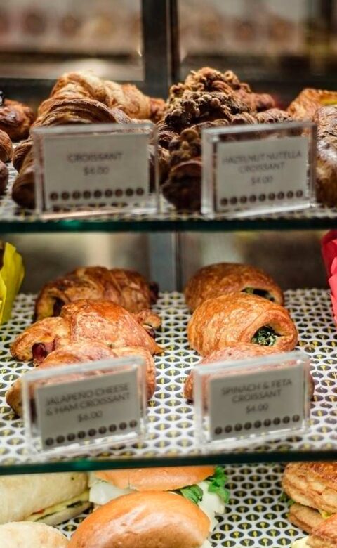 a display case of fresh baked goods at The Marketplace