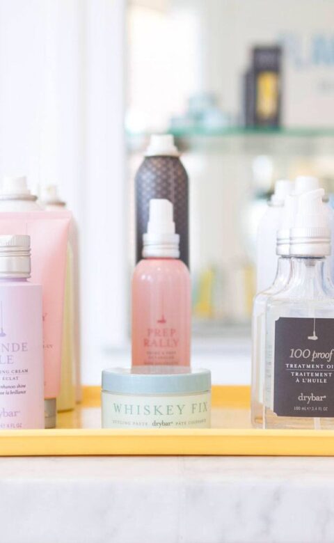 various Drybar hair products on display on a tray