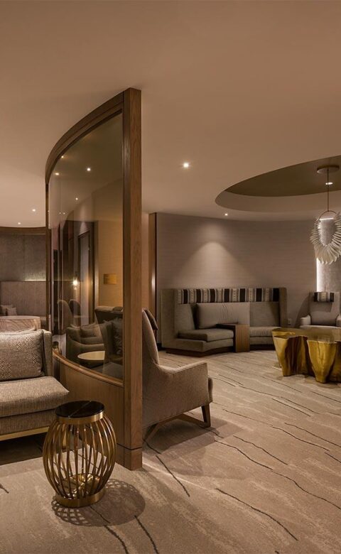 a luxury spa lounge area with comfortable seating and dim lighting