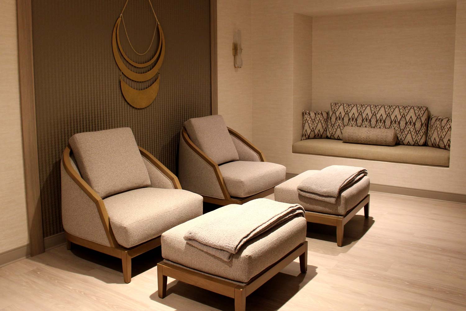 two comfortable chairs with foot-stools in the tranquility spa suite