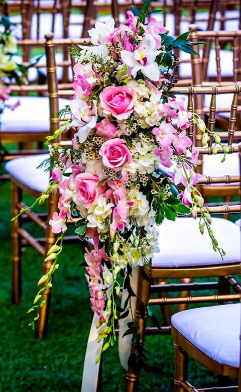 Elaborate flora and fauna line the rows of chairs