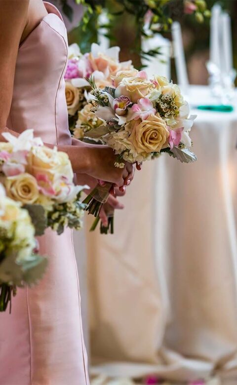 Graceful bridesmaids watch as the ceremony takes place