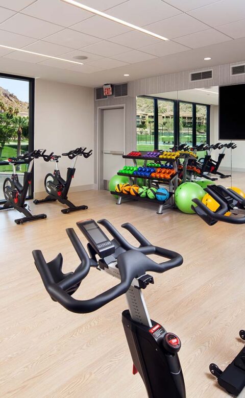Athletic Club Movement Studio with exercise bikes and weights
