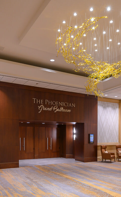 large ballroom with chandelier hanging from the ceiling