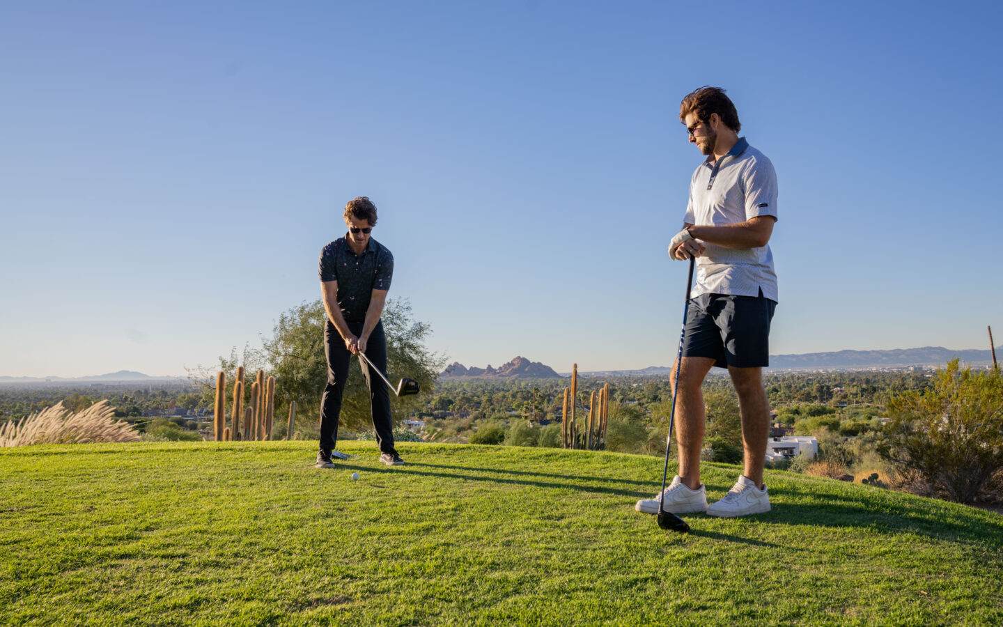 a couple of men playing golf