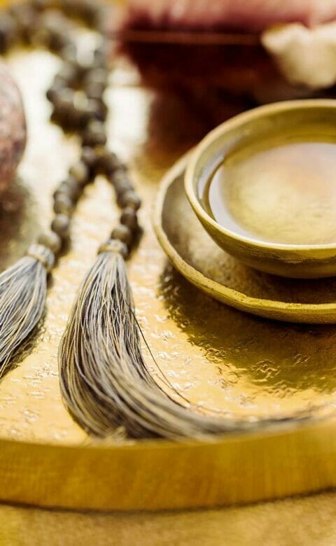 spa massage products on golden platter