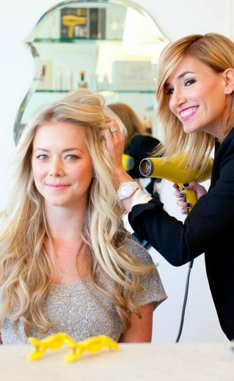 a woman getting her hair dried at Drybar at The Phoenician Spa