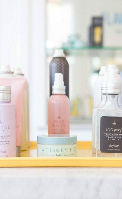 various Drybar hair products on display on a tray