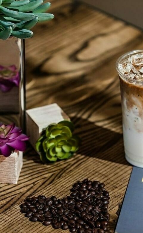 mocha frappe on wooden table with marketplace menu