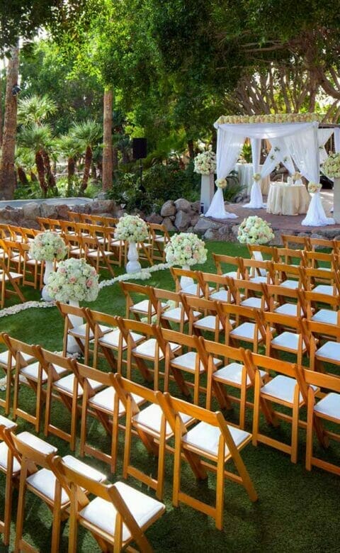 rows of chairs set up facing the altar for an Orchid Lawn Wedding