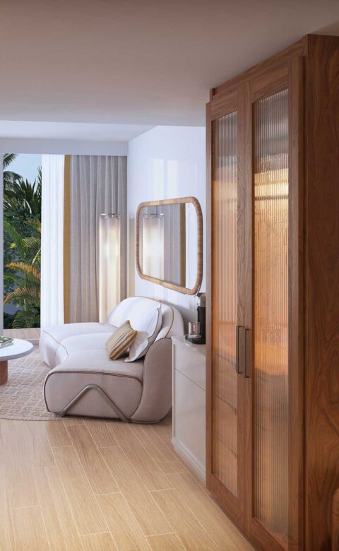 King guestroom with lounge seating, custom cabinetry, and warm lighting details