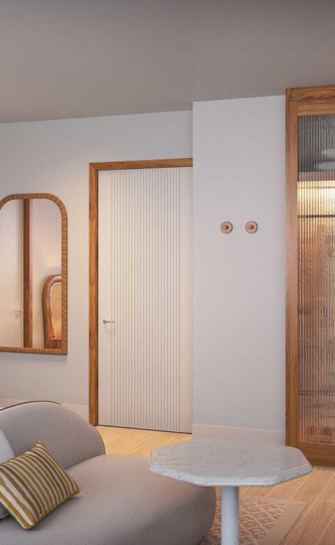 King guestroom with lounge seating, custom cabinetry, and warm lighting details