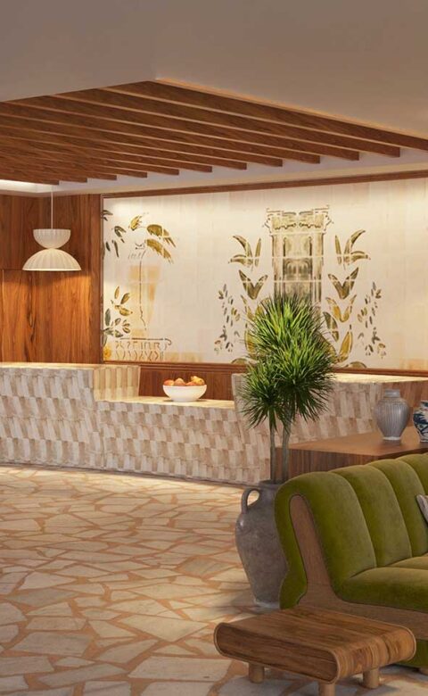 Lobby space featuring green velvet seating, custom wall art, and a wine display.